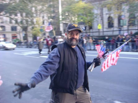 20071111-veterans-day-parade-43-vietnam-vet-handing-out-flags.jpg